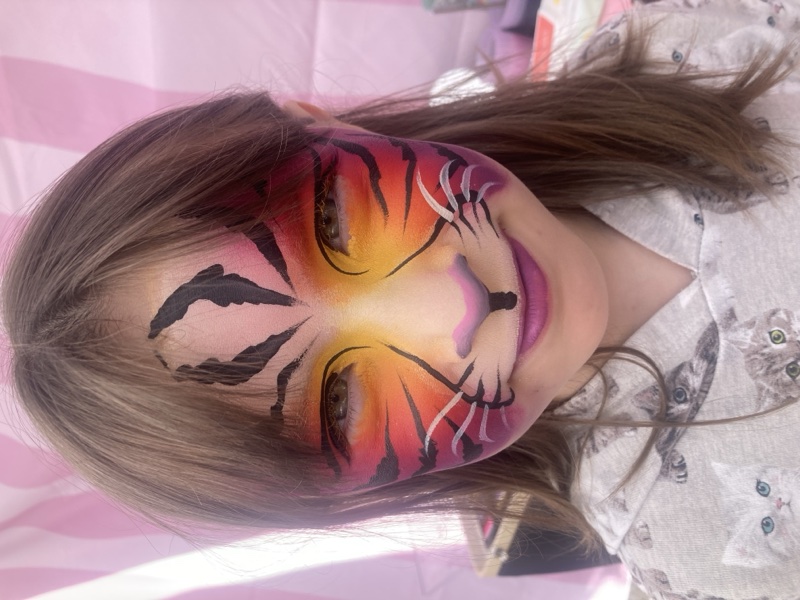 Sunset Tiger — warm orange and pink tiger full face